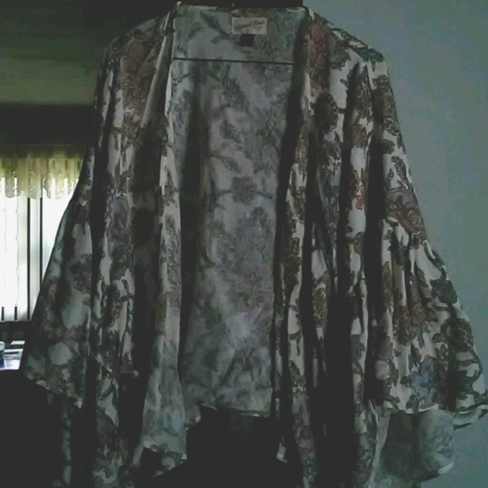 Top with flared ruffled sleeves